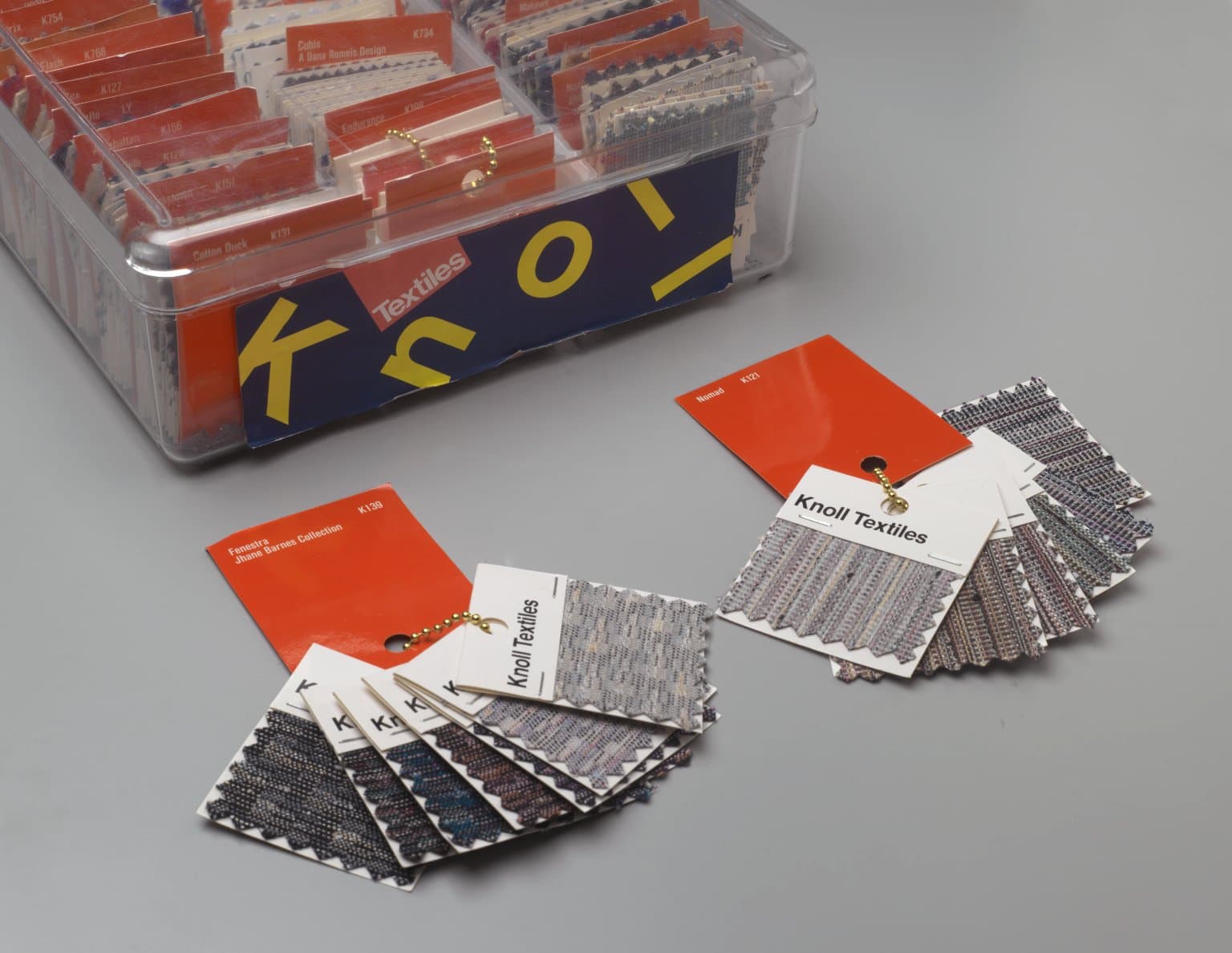 Press-side colour proof sheets and print samples on a production review table